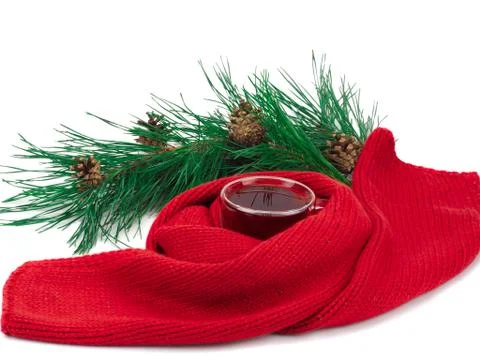 Black tea in the cup, scarf around the cup and a branch of spruce Stock Photos