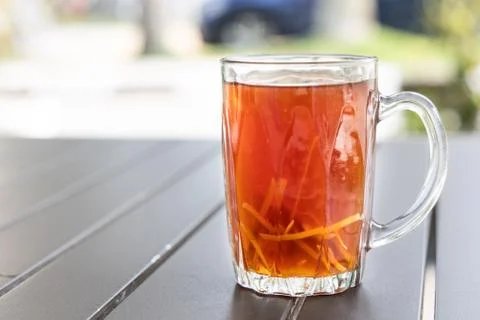 Black tea with ginger slice or known as Teh O Halia Stock Photos