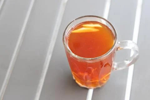 Black tea with ginger slice or known as Teh O Halia Stock Photos
