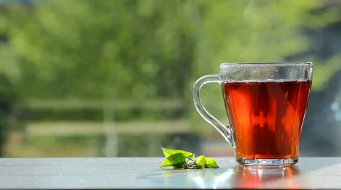 Black tea in glass,transparent cup at breakfast Stock Footage 50055427