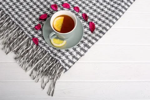 Black tea with lemon in a gray cup and saucer Photos