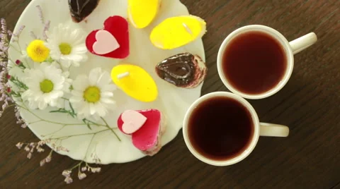 Black tea in mugs. lunch. table with a drink and dessert. view from above Stock Footage 67811148