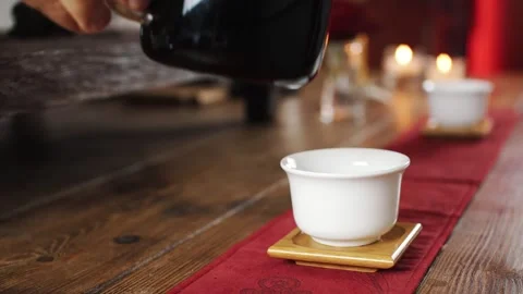 Black tea is poured into cups Stock Footage 137574987
