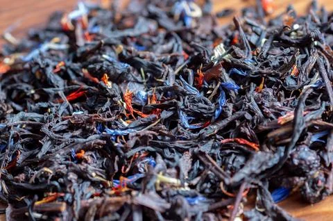 Black tea with a selection of different herbs Stock Photos
