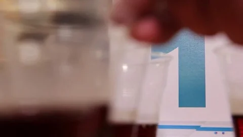 Black tea in small cups for tasting, tea production Stock Footage 75475469