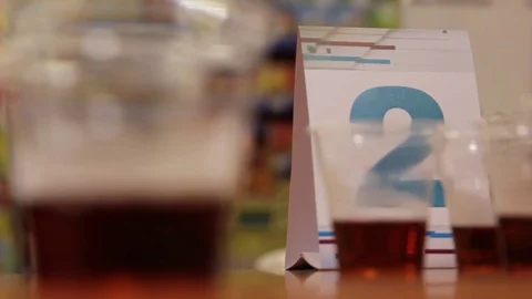Black tea in small cups for tasting, tea production, tea tasting Stock Footage 75475517