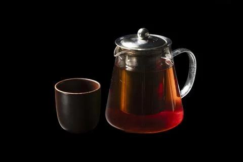Black Tea in Teapot with Cup Stock Photos