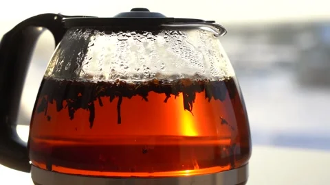 Black tea in water closeup on window. Stock Footage 134890408