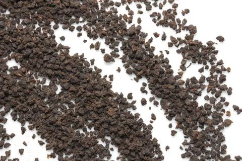Black tea on a white background. macro Stock Photos