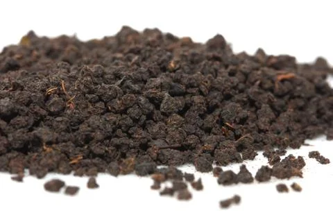 Black tea on a white background. macro Stock Photos