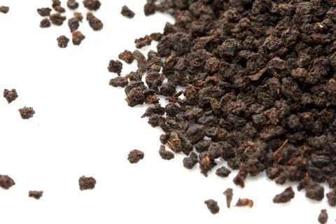 Black tea on a white background. macro Stock Photos