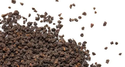Black tea on a white background. macro Stock Photos