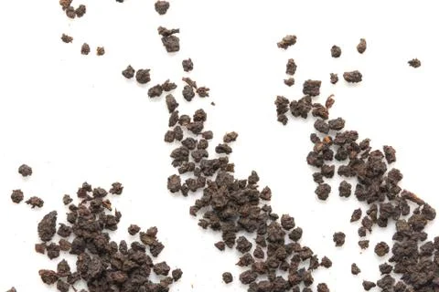 Black tea on a white background. macro Stock Photos