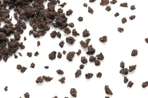 Black tea on a white background. macro Stock Photos