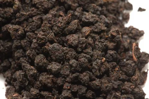 Black tea on a white background. macro Stock Photos