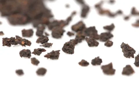 Black tea on a white background. macro Stock Photos