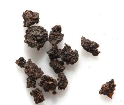 Black tea on a white background. macro Stock Photos