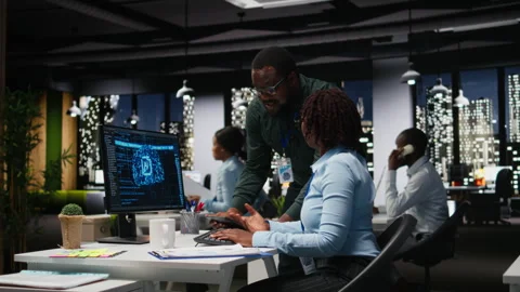 Black team of colleagues use artificial intelligence and predictive analytics Stock Footage 318499352