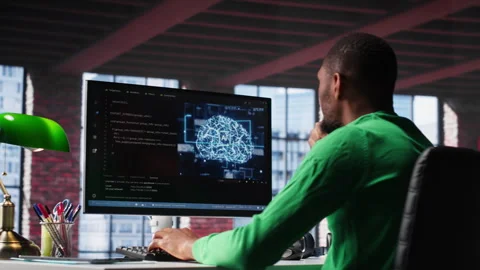 Black tech engineer programming an AI brain neural network for machine learning Stock Footage 307795684