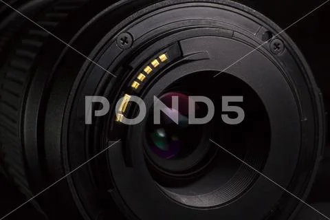 Black telephoto lens body on dark background Stock Photos