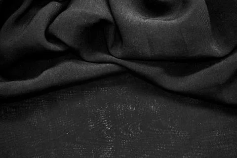 Black textile pattern as a background. Black material texture on fabric Stock Photos