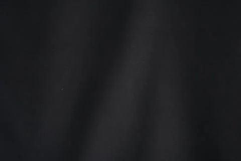 Black textile texture with subtle wavy pattern. Stock Illustration