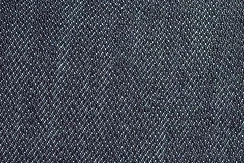 Black texture background, jeans texture, fabric. Denim jeans background. Stock Photos
