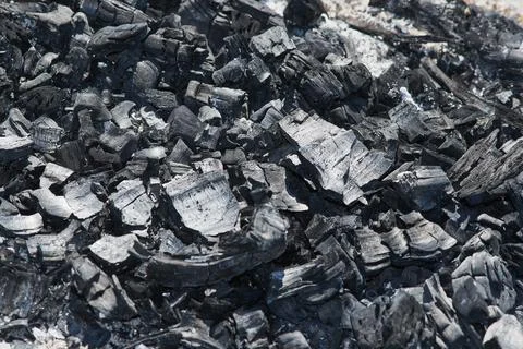 Black texture of coarse ash, in an extinct fire Stock Photos