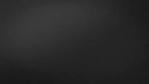 Black textured background with subtle gray gradient grainy effect for 4K ab.. Stock Photos
