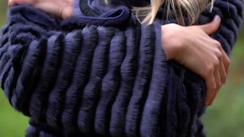 Black thick eco fur on the model. replacement of natural fur with eco-fur	 Stock Footage 229871778