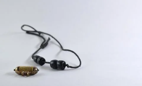 Black thread against a white background Stock Photos