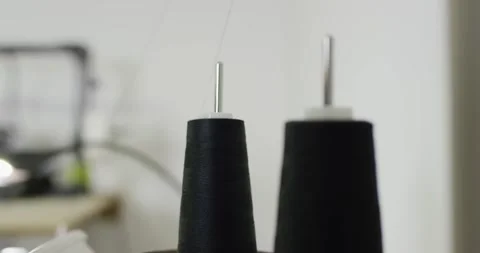 Black Thread Cones Feeding Yarn, Textile Workshop, Close Up Shot Stockbeeldmateriaal 341316423