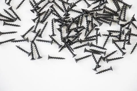 Black threaded screw on the green background Stock Photos