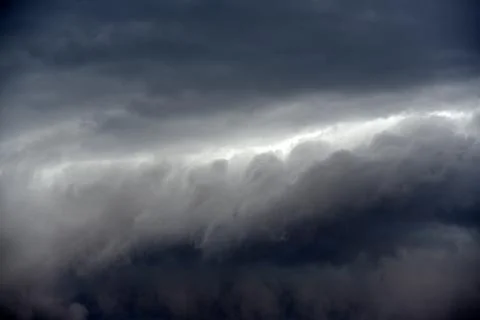 Black thunderstorm storm clouds on a summer day. Beautiful terrible thunderst Fotos de archivo