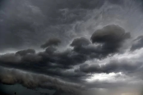 Black thunderstorm storm clouds on a summer day. Beautiful terrible thunderst Fotos de archivo