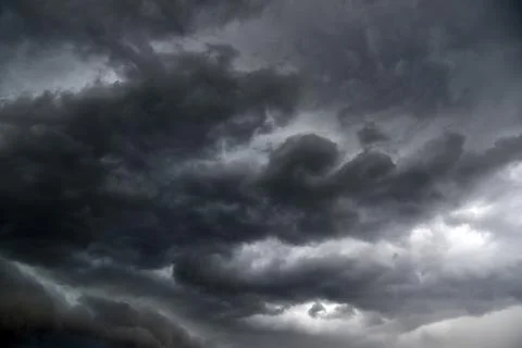 Black thunderstorm storm clouds on a summer day. Beautiful terrible thunderst Fotos de archivo