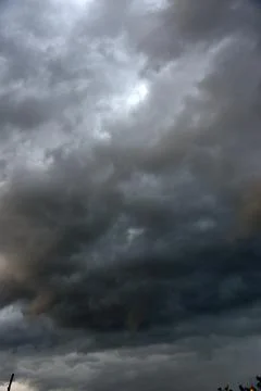 Black thunderstorm storm clouds on a summer day. Beautiful terrible thunderst Fotos de archivo