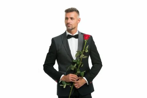 Black tie dress code for evening events. tuxedo man with rose flower. happy 写真素材