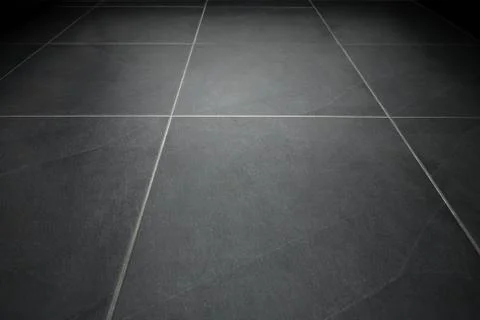Black tile flooring close up as background Foto stock