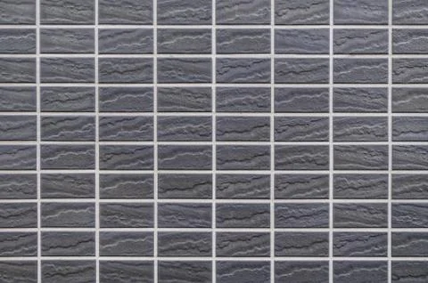 Black tile wall pattern background Stock Photos