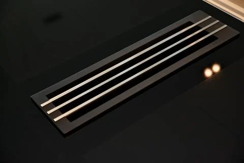 Black tiled floor with vent grid Stock Photos