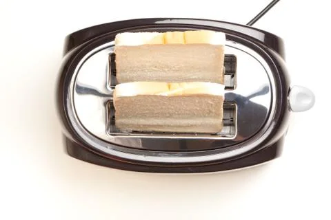 Black toaster, two slices of bread, on white background Stockfoto's