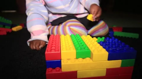 Black toddler playing with building blocks Stock Footage 43973250