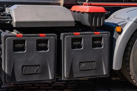 Black toolboxes under the back of a big truck. Stock Photos