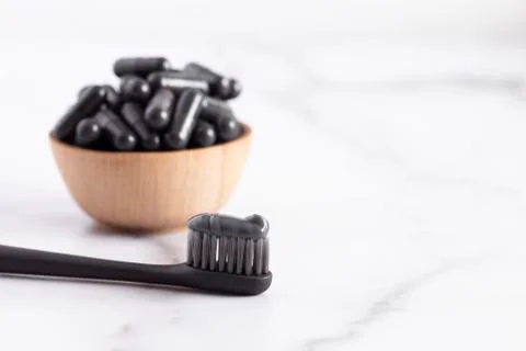 A Black Toothpaste with Capsule of Activated Charcoal Stock Photos
