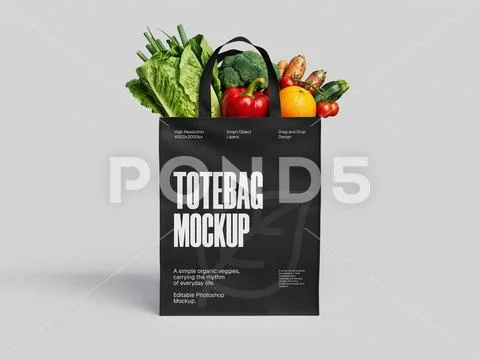 Black Tote Bag Mockup Filled with Fresh Organic Vegetables on Gray Background Modèle PSD