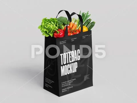 Black Tote Bag Mockup Filled with Fresh Organic Vegetables on Gray Background PSD Template