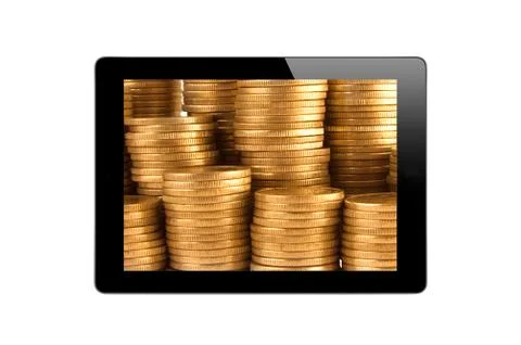 Black Touch Screen Tablet and golden coins Stock Photos