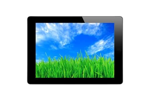 Black Touch Screen Tablet, blue sky and green grass Stockfoto's