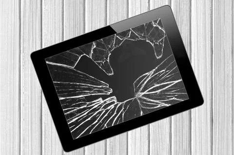 Black Touch Screen Tablet with broken screen over wooden background Stock Photos